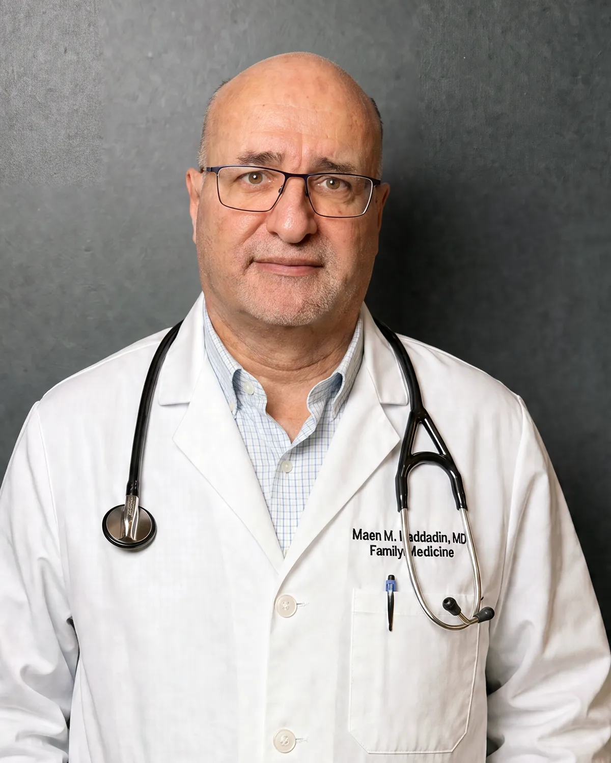 A Portrait of Dr. Maen Haddadin standing in a clinic office in Omaha Nebraska. 