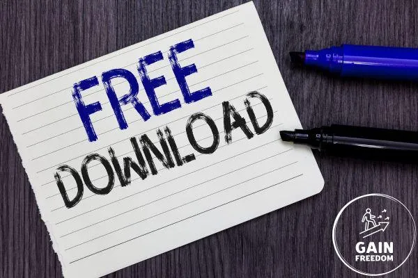 Kostenlose Ressourcen bei Gain Freedom – Notizblatt mit 'Free Download' und Gain Freedom Logo, Hinweis auf kostenfreie Downloads und hilfreiche Materialien für finanzielle Freiheit auf www.gainfreedom.de/kostenlose-ressourcen.