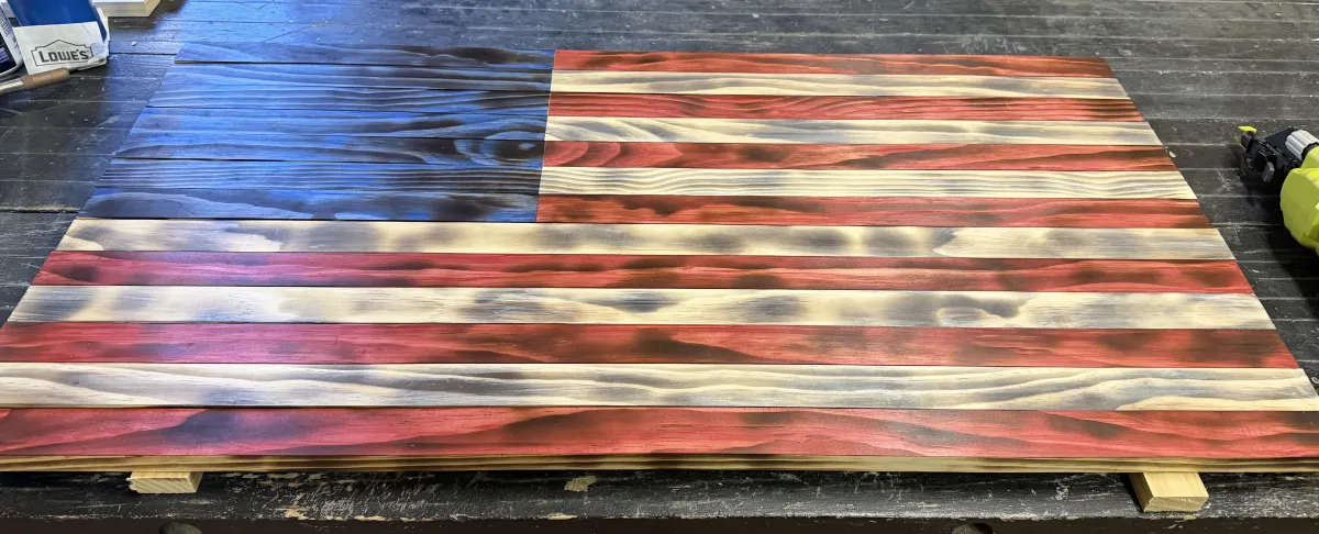 Craftsman in a welding mask working with sparks