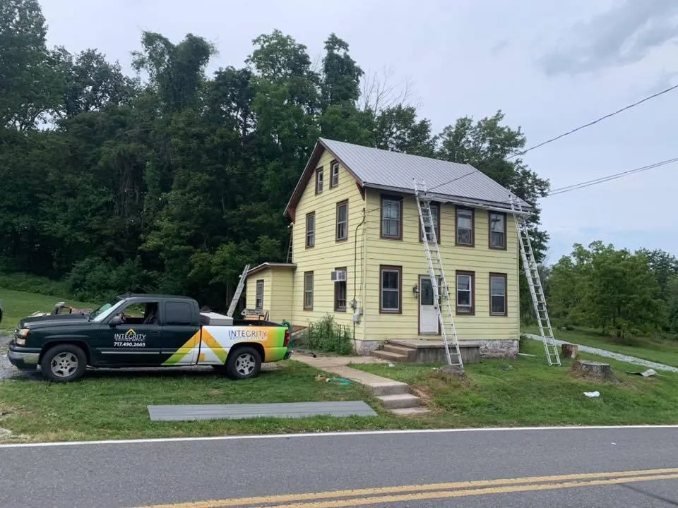 a white house with cool roofing