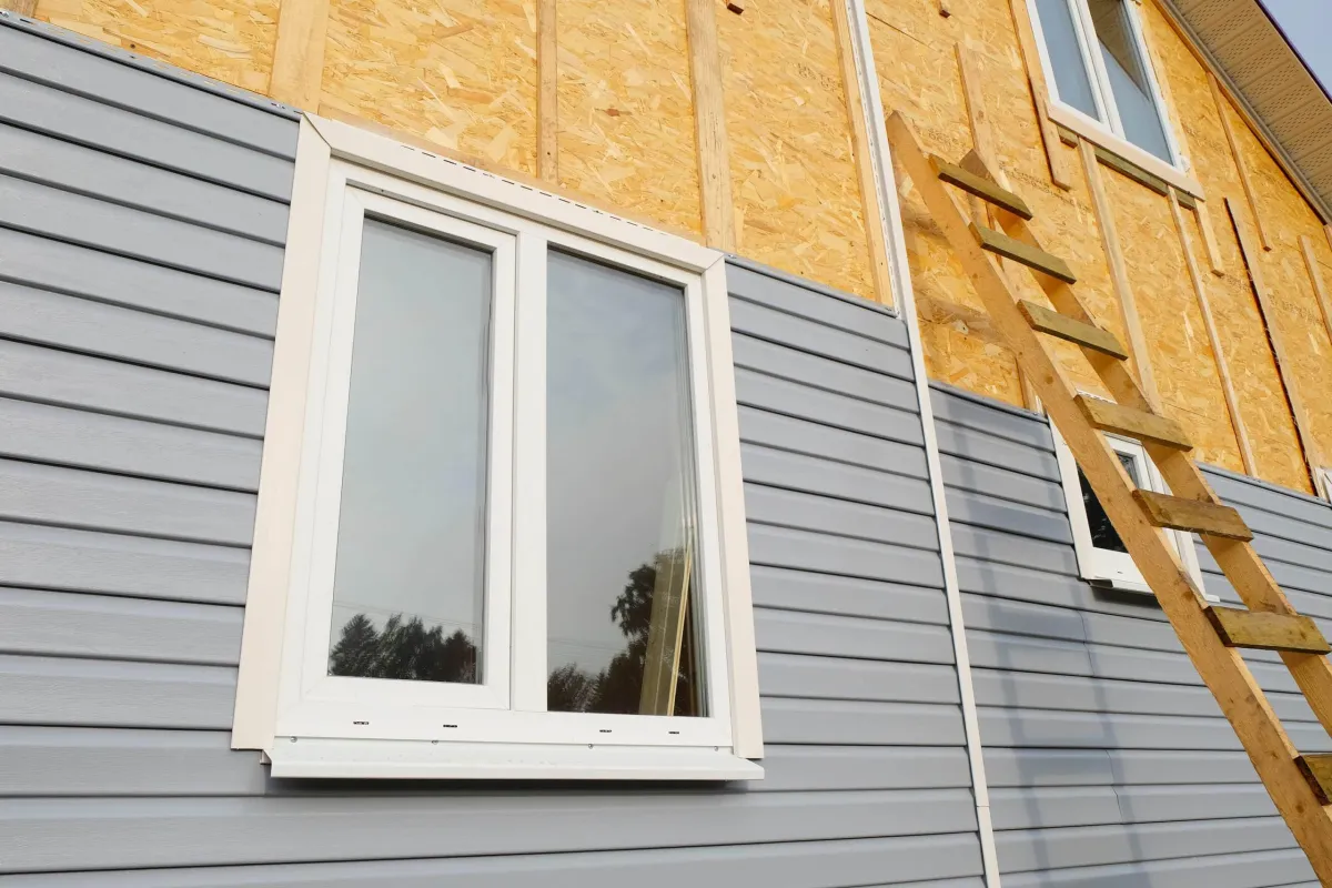 a siding of a house with ladder