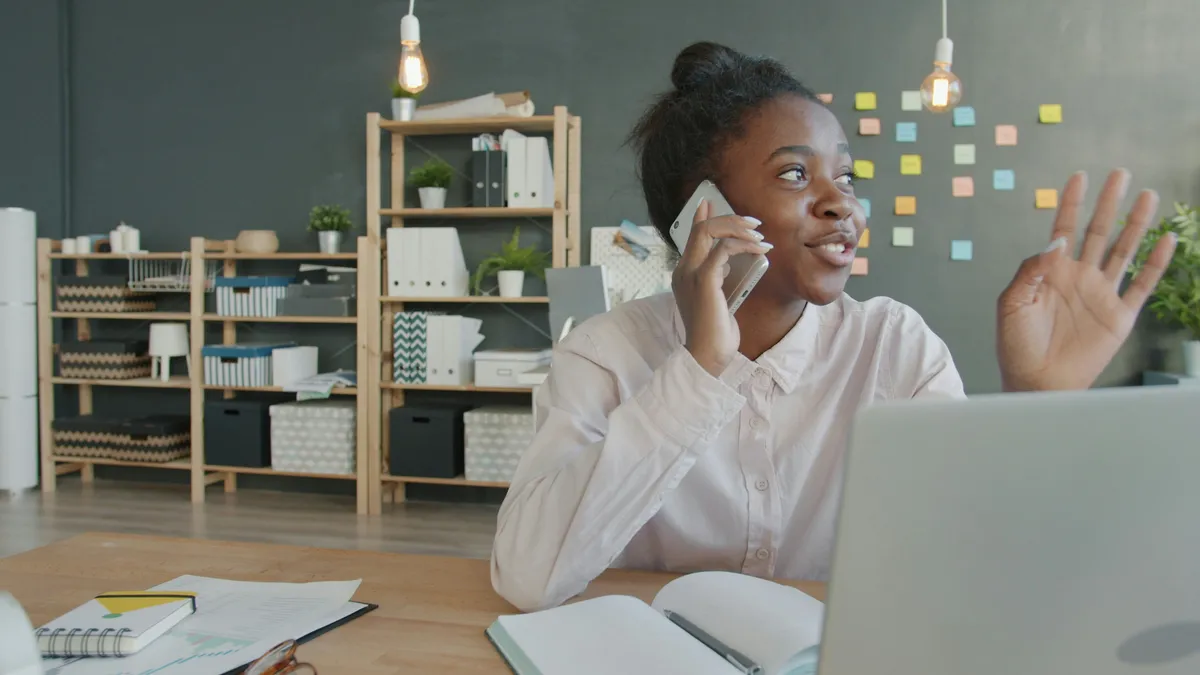 Property manager speaking with an owner by phone