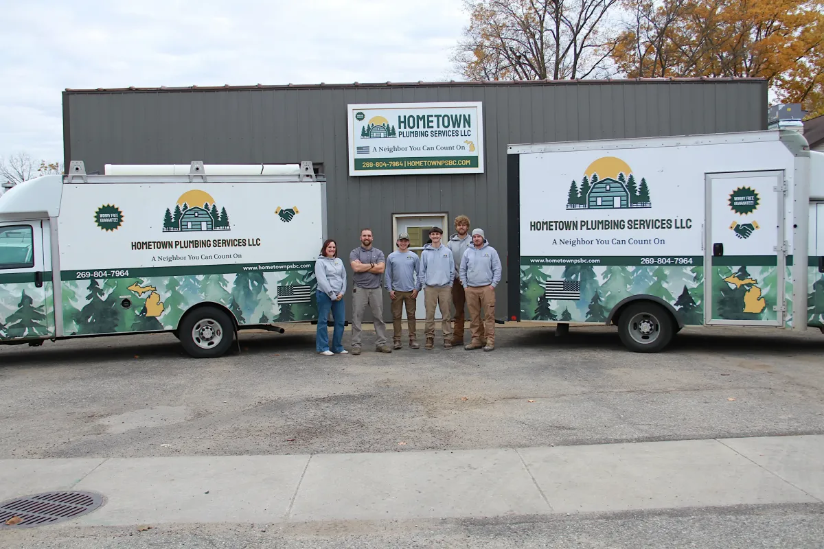 The Hometown Plumbing Services LLC team of licensed specialists with their professional service vans, providing expert well and pressure tank repairs throughout Barry County.