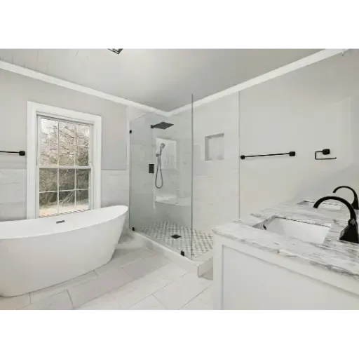 Luxury master bathroom remodel in Barry County featuring a custom glass walk-in shower, freestanding soaking tub, and professional plumbing rough-in.