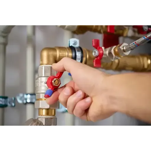 Installation of a new brass quarter-turn shutoff valve to provide reliable emergency water control for a home plumbing system.