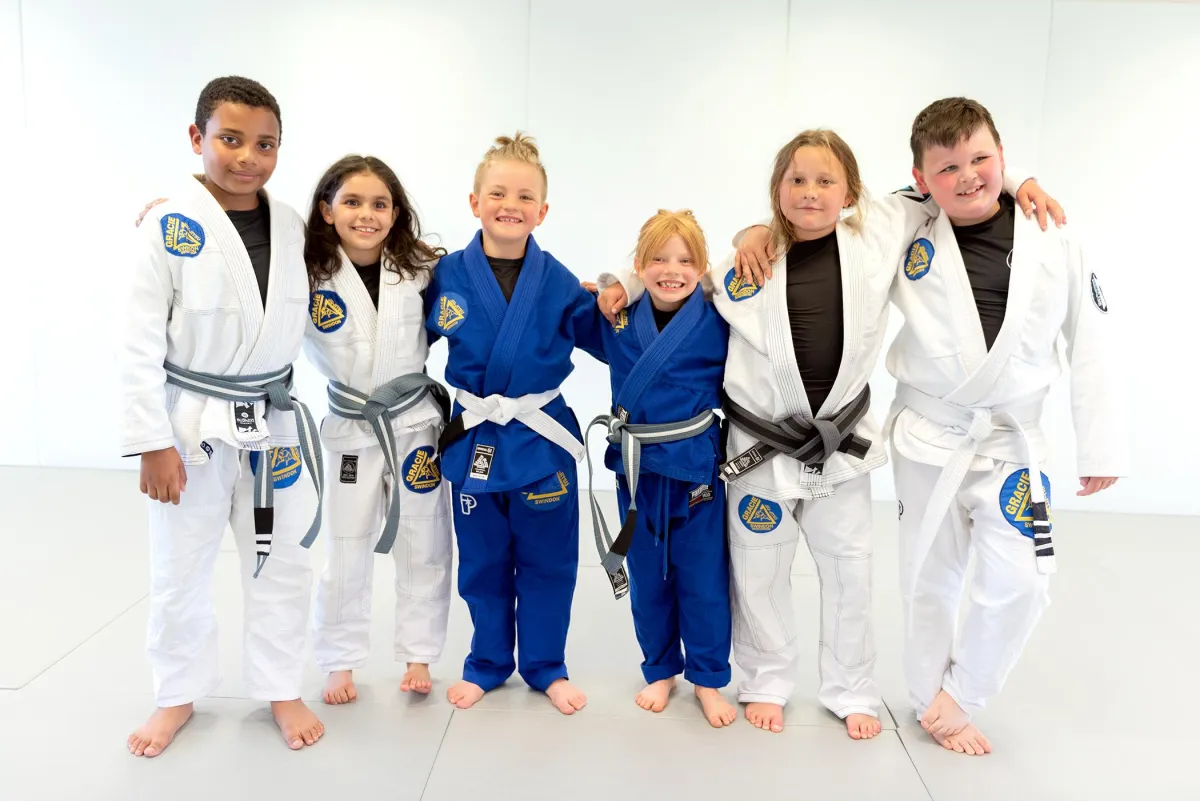 Kids smiling in martial arts class