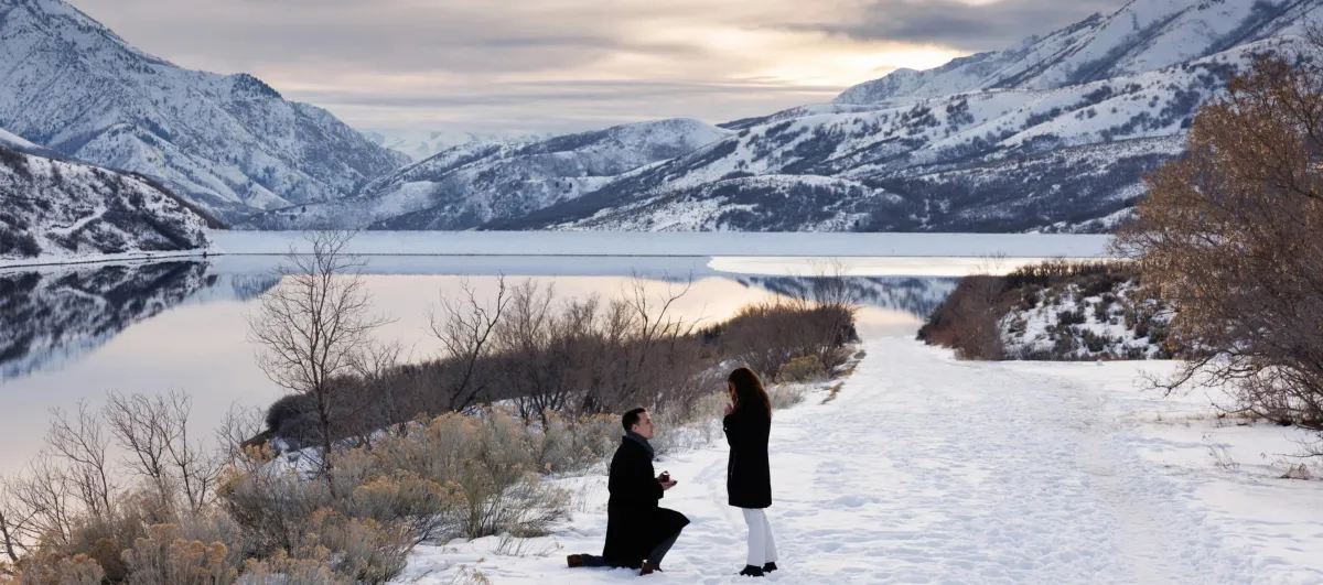 Utah Lake proposal at sunset with Wasatch Mountains in background"