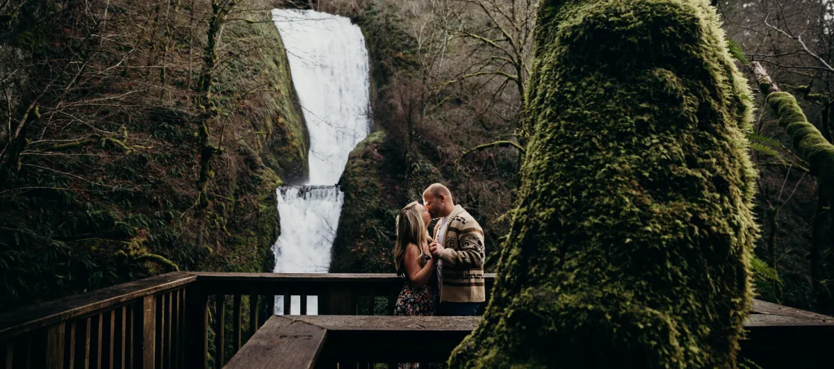 Bridal Veil Falls proposal in Provo Canyon with waterfall backdrop