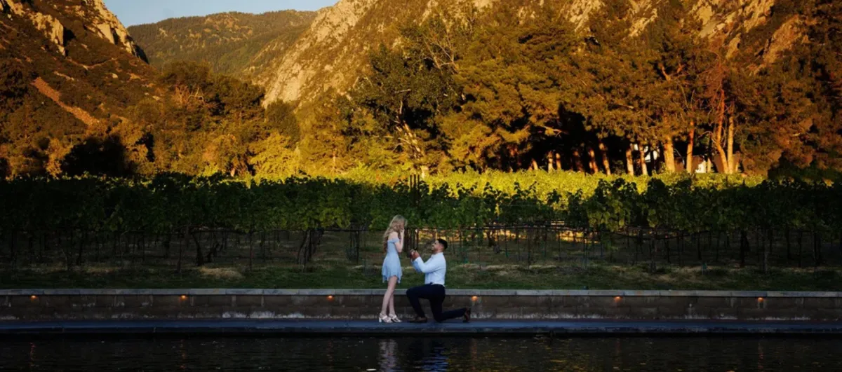 La Caille proposal with French gardens, vineyard, and mountain backdrop