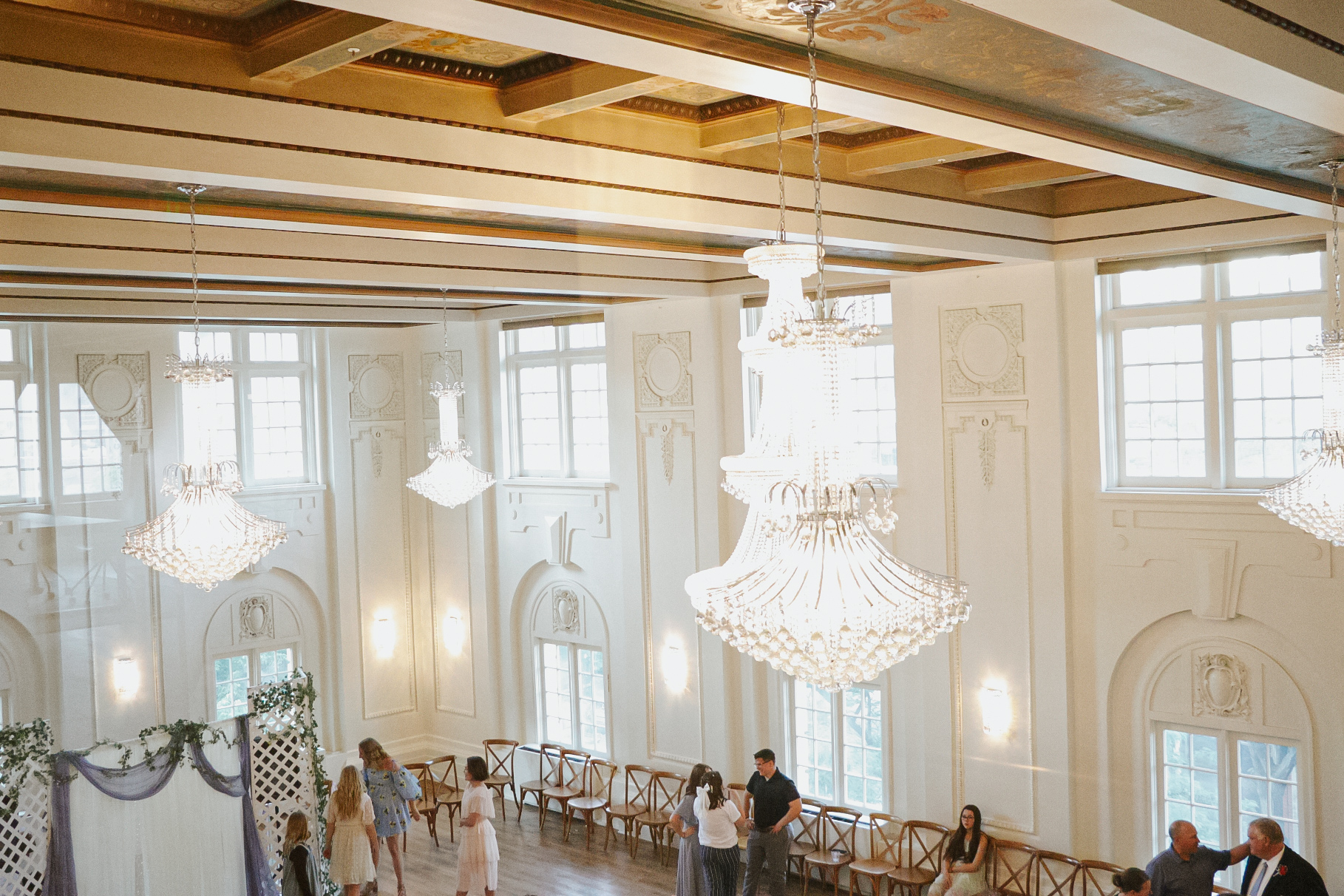 Temple Terrace Event Center exterior at dusk with warm entry lighting and landscaping