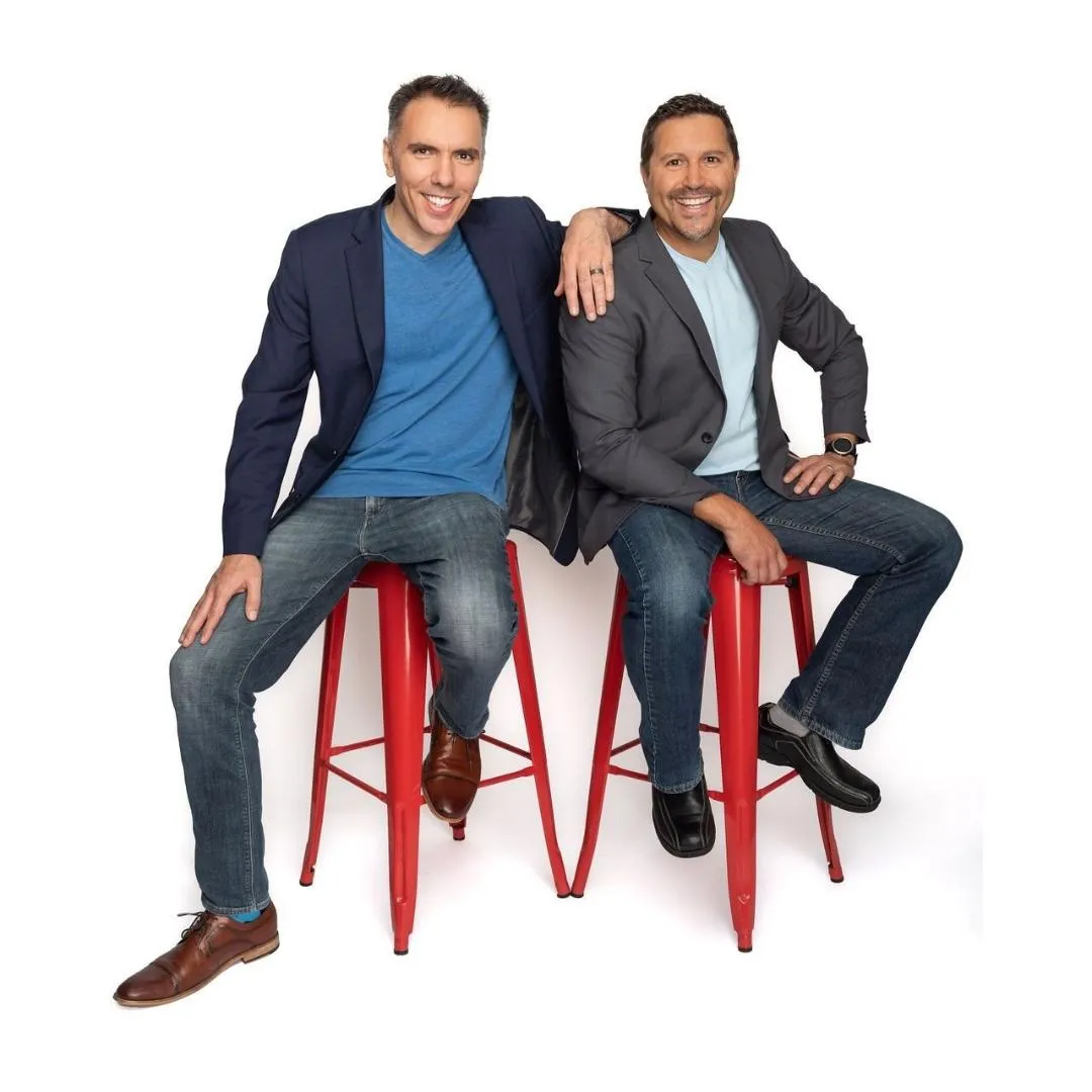 A conceptual digital artwork showing a coach standing at the base of a staircase made of glowing blue steps, each labeled with a growth milestone, set in a bright, open space, symbolizing the journey to business success.