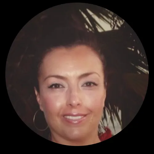Professional headshot of a middle-aged Hispanic woman in a purple blazer, smiling confidently. She is the Director of Talent Acquisition for a Fortune 500 company in Houston, Texas, and founder of a cross-border Arizona horse ranch near the Mexico–United States border.