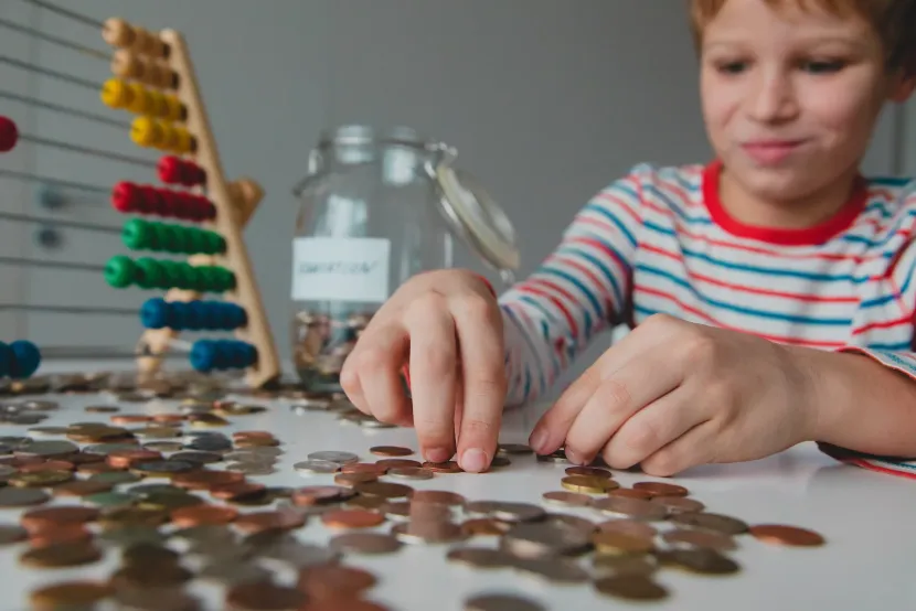 Curious boy counting coins