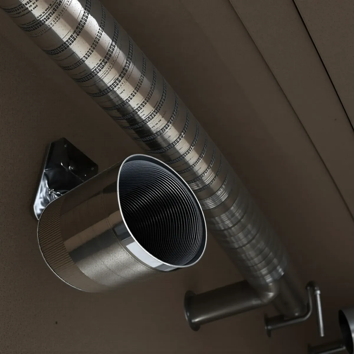 High-quality image of commercial building air ducts in Weatherford, TX, highlighting texture and metallic surface details.