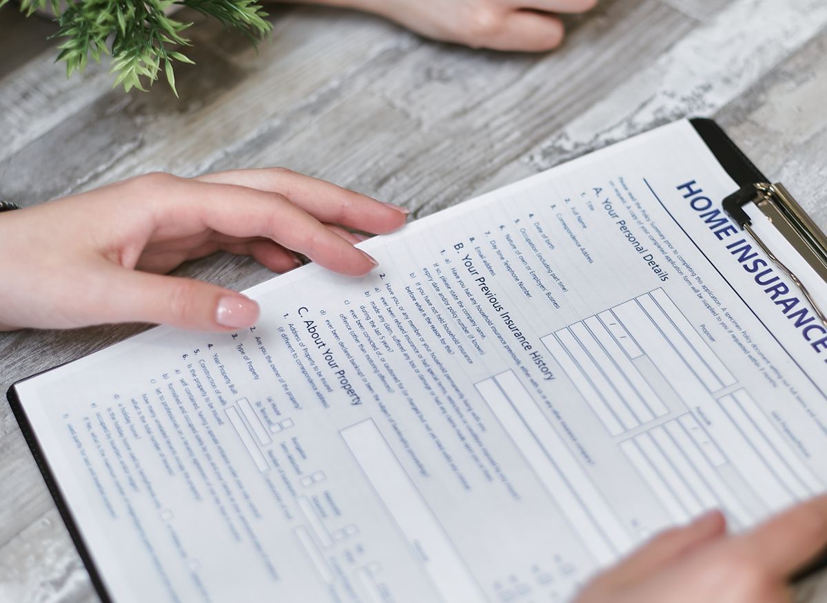Reviewing a home insurance policy document, Santa Clarita home buying