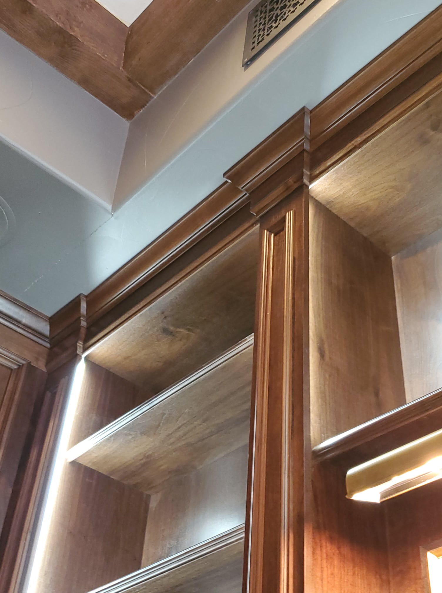 a large kitchen with a center island in the middle of the room