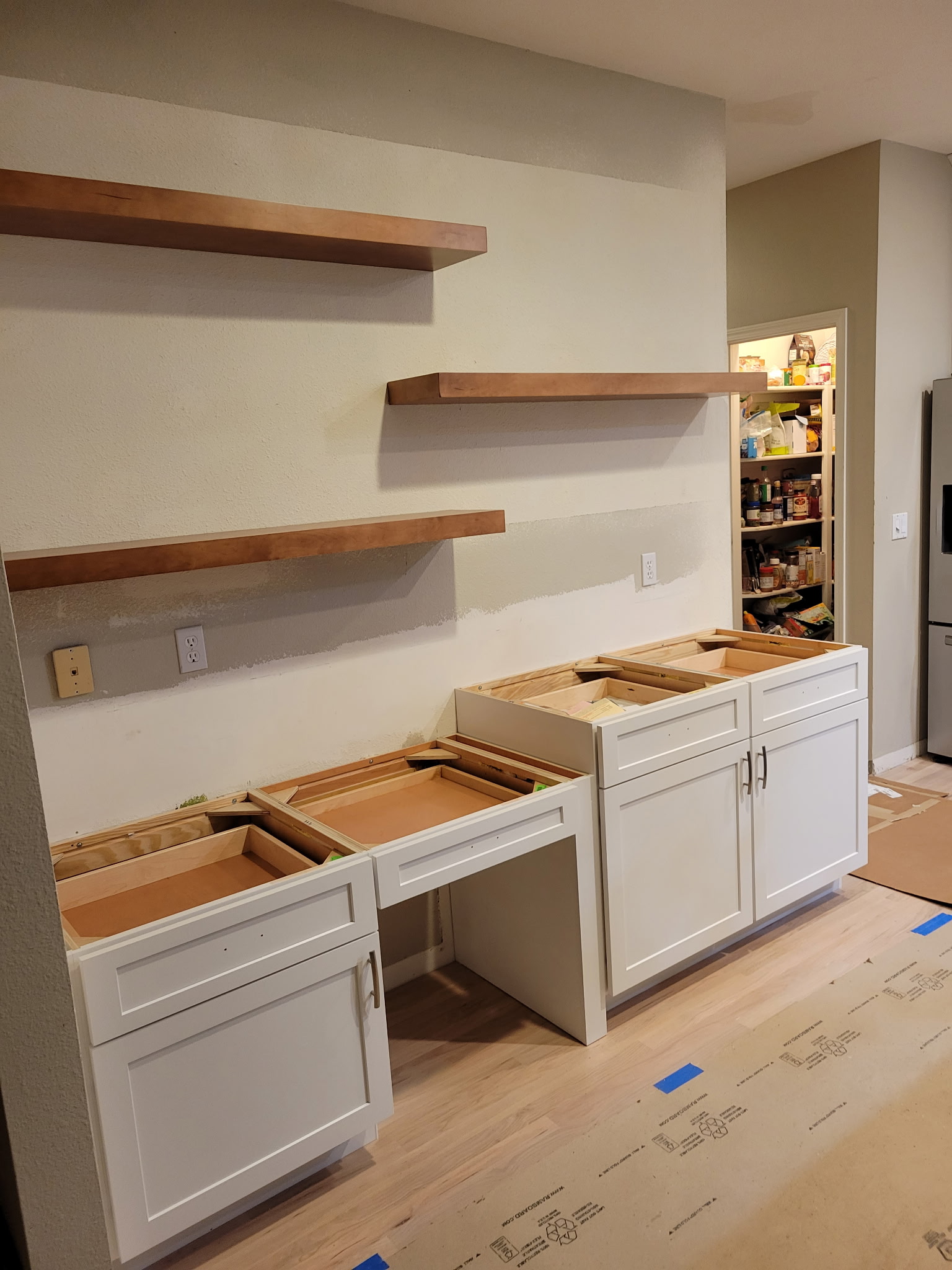 a kitchen with white cabinets