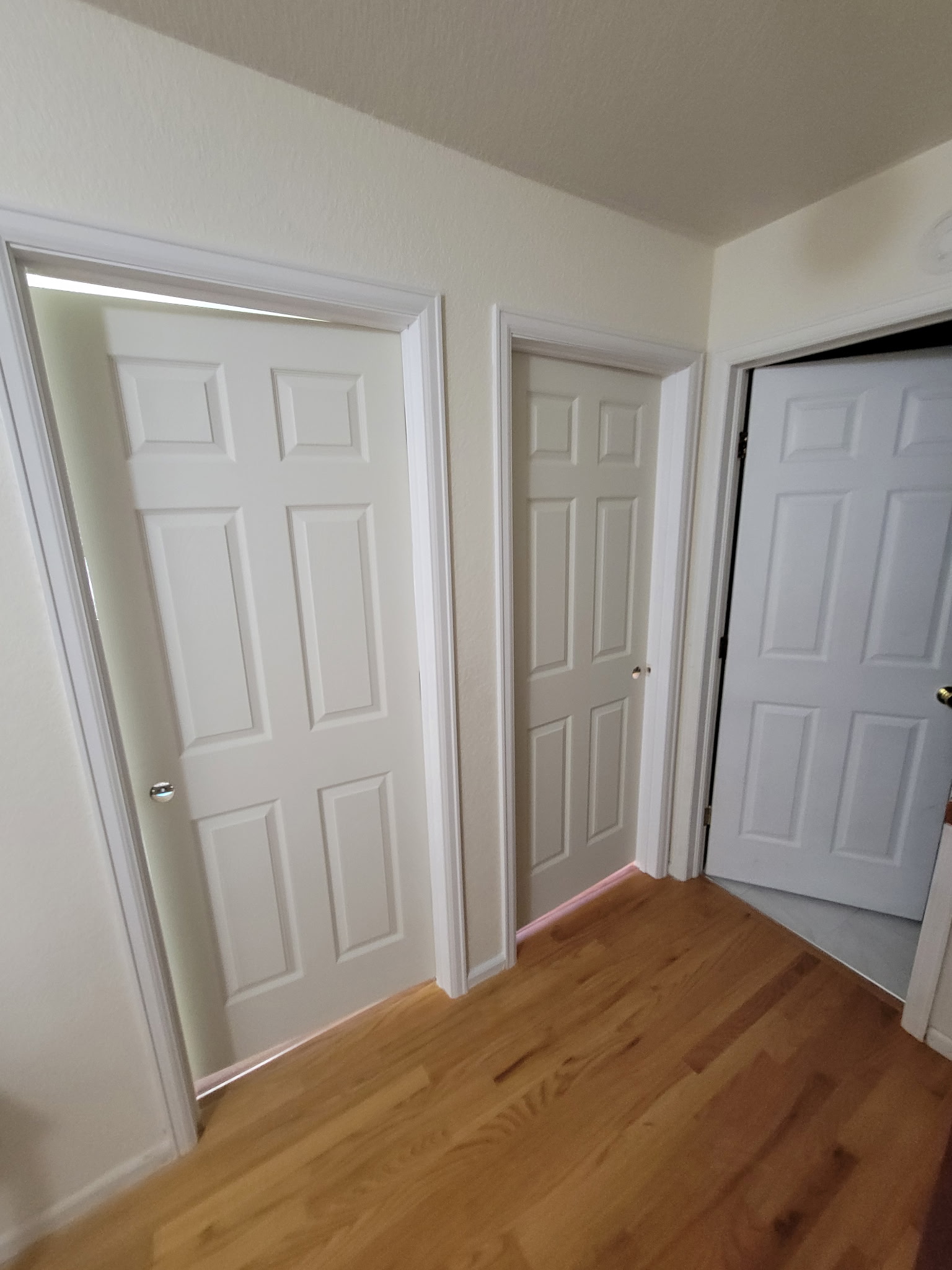 a large kitchen with a center island in the middle of the room