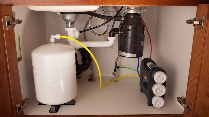 Reverse osmosis water filtration system installation under sink