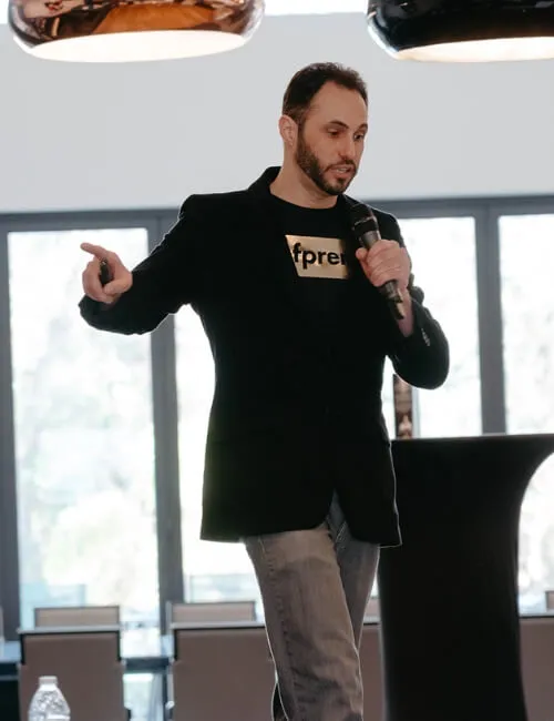 PremierPath Systems founder Brett Martucci presenting marketing information on stage