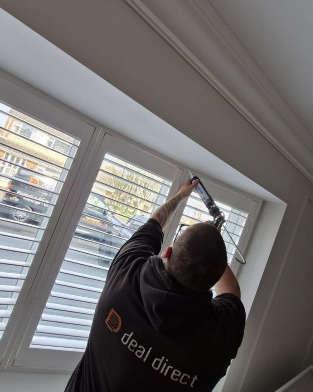Fitter installing blind
