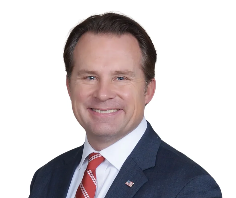 A person riding a bike down a street