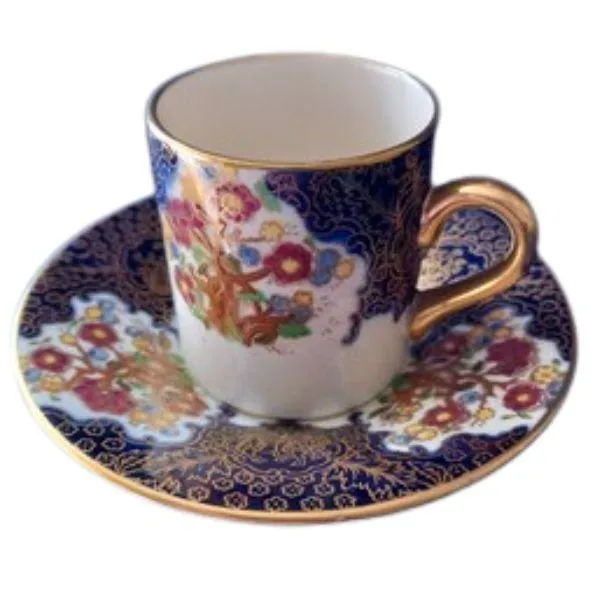 Soho Pottery Ambassador Ware demitasse cup and saucer, cobalt blue with gold gilding and floral design.