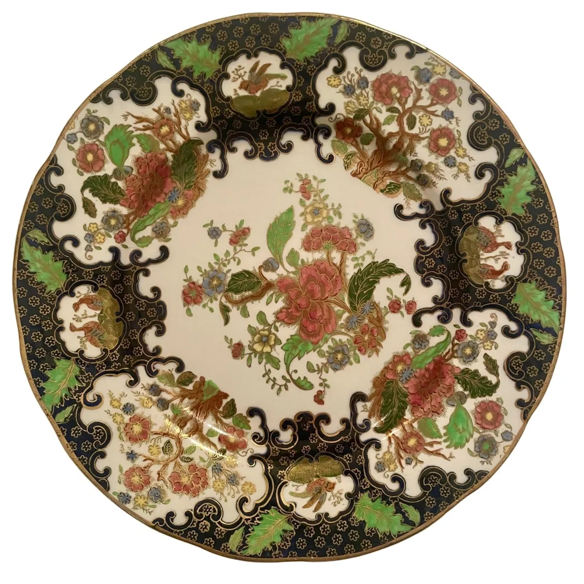 Soho Pottery Ambassador Ware round plate, multicolor floral pattern with blue, red, green, and gold accents, vintage collectible.