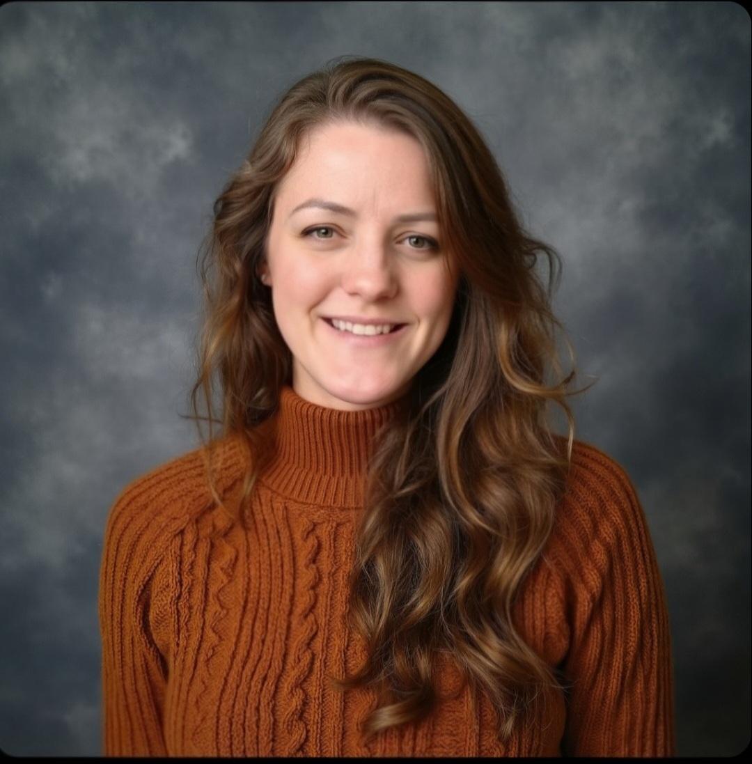 short-haired black cat besides brown wooden table