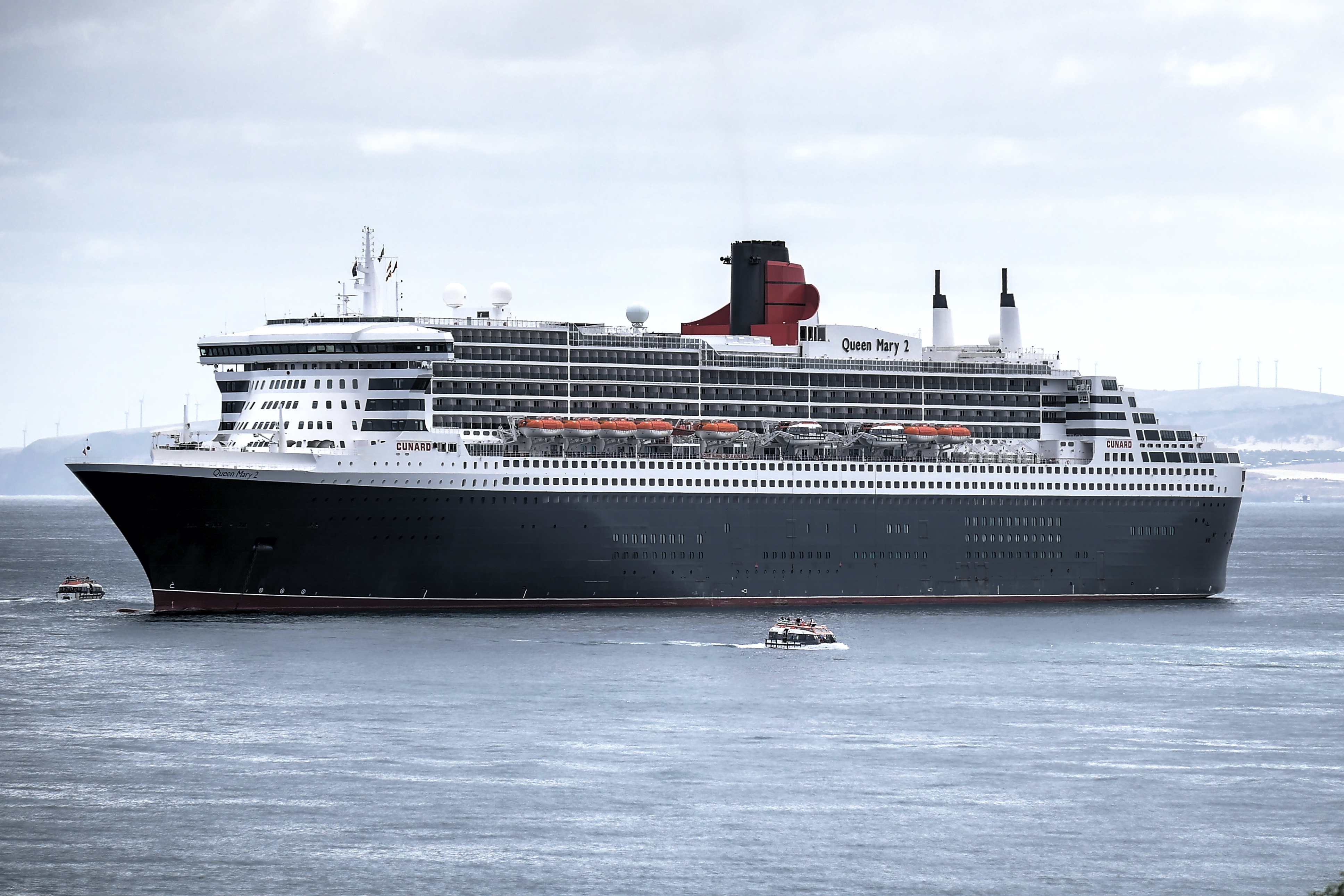 Scenic view of Penneshaw wharf with a tender boat arriving from a cruise ship