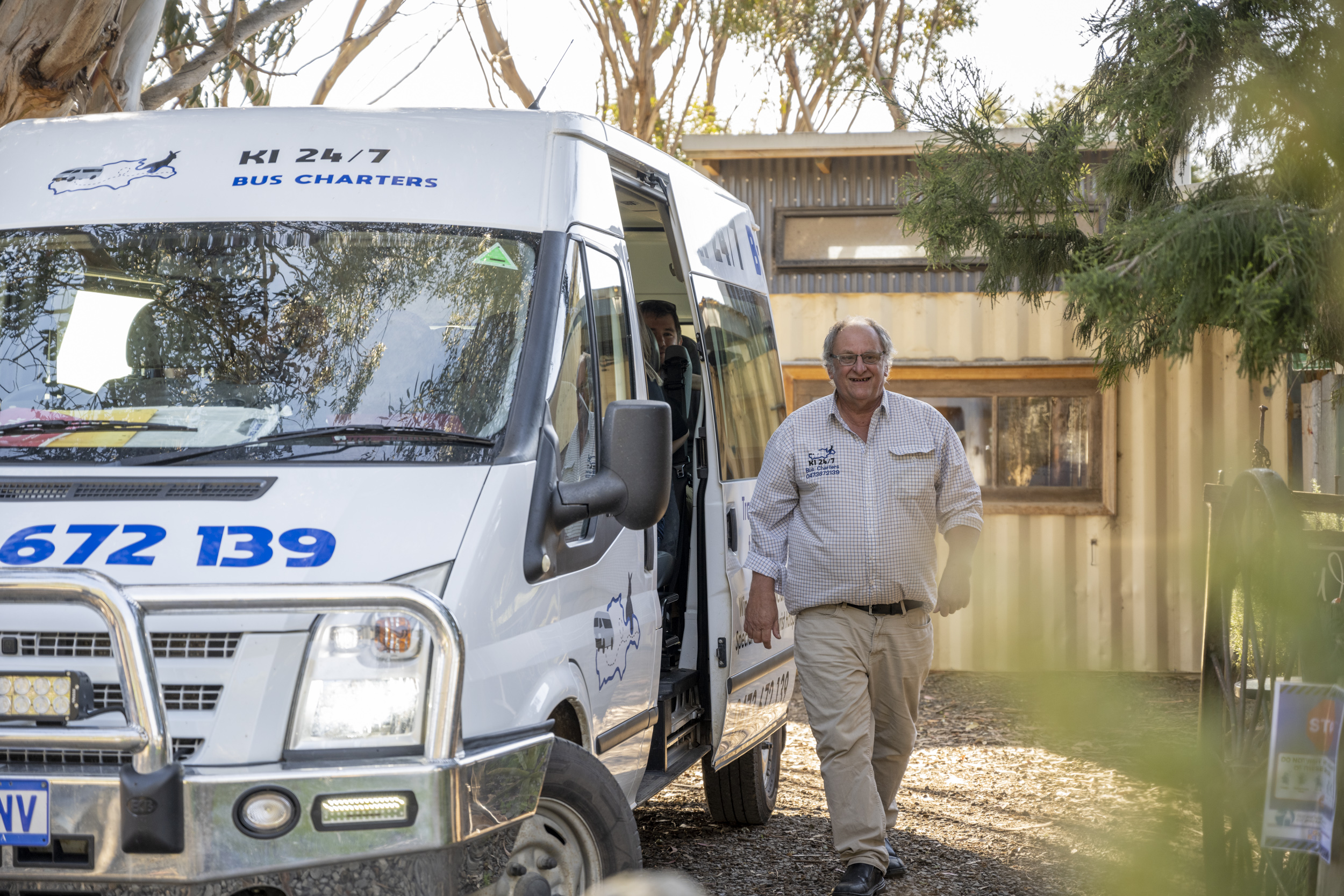 Colin and the Kangaroo Island Tours minibus on a coastal road