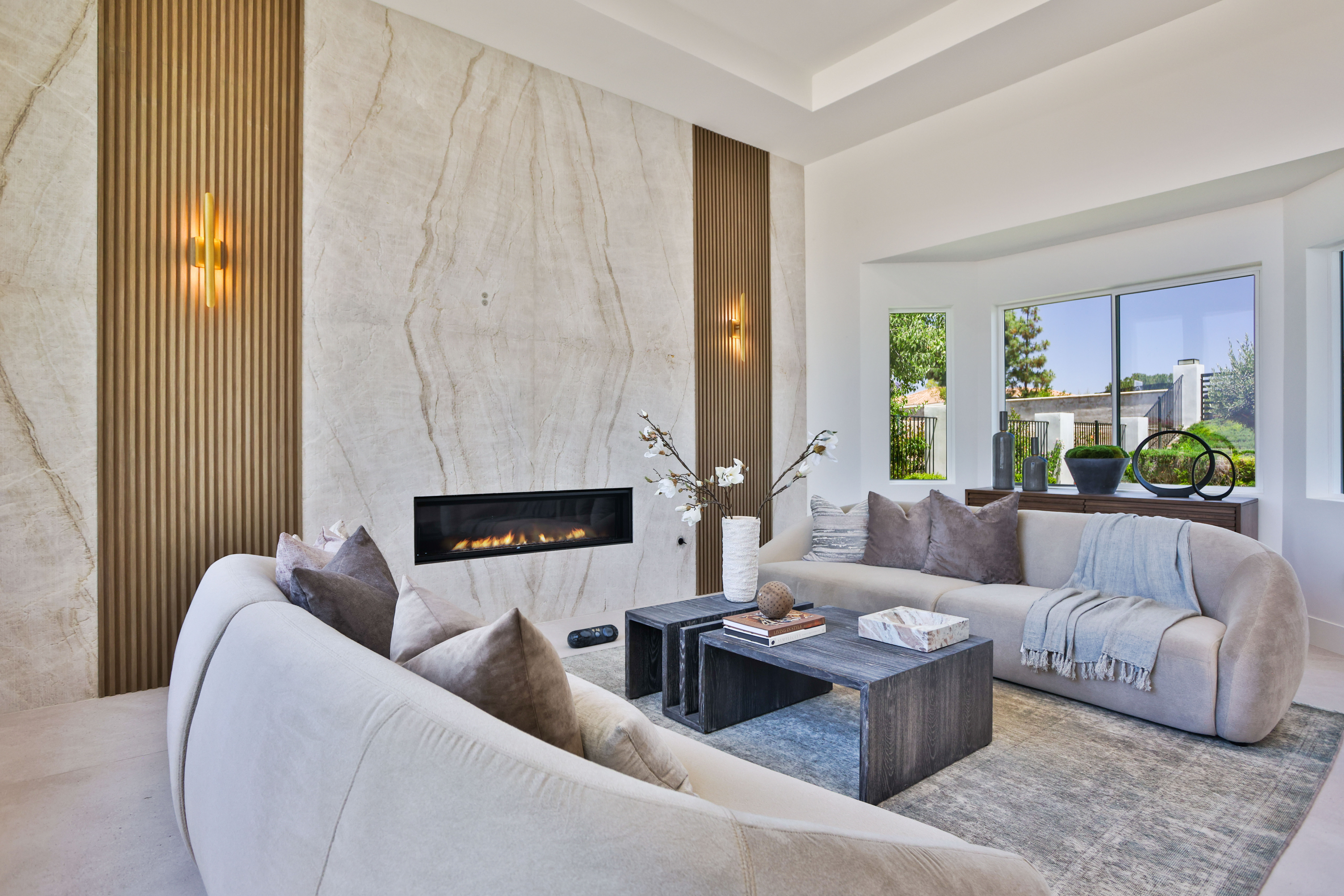 man riding motocross dirt bike on brown field under blue and white cloudy sky during daytime