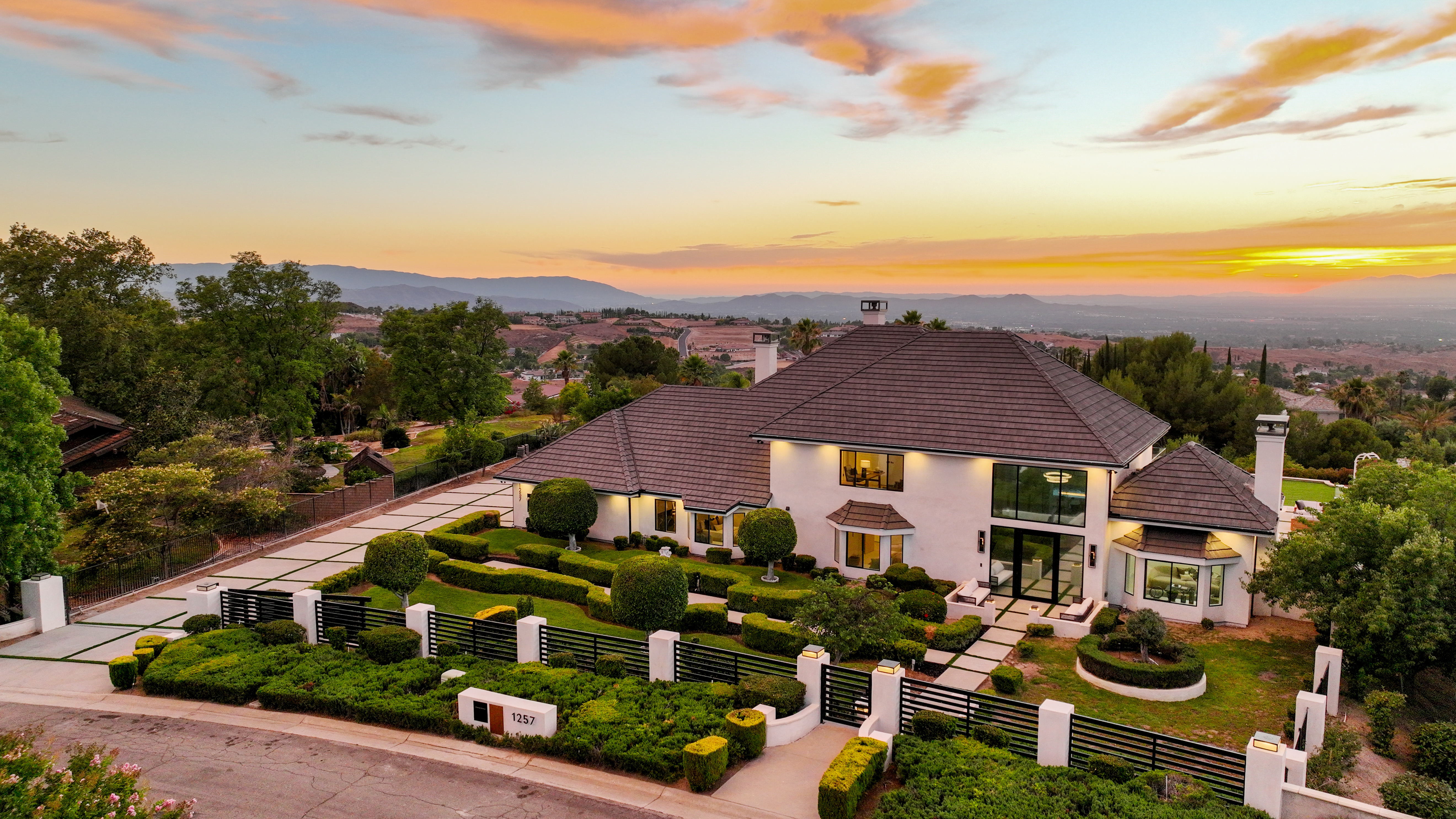 grayscale photo of men sitting on bench