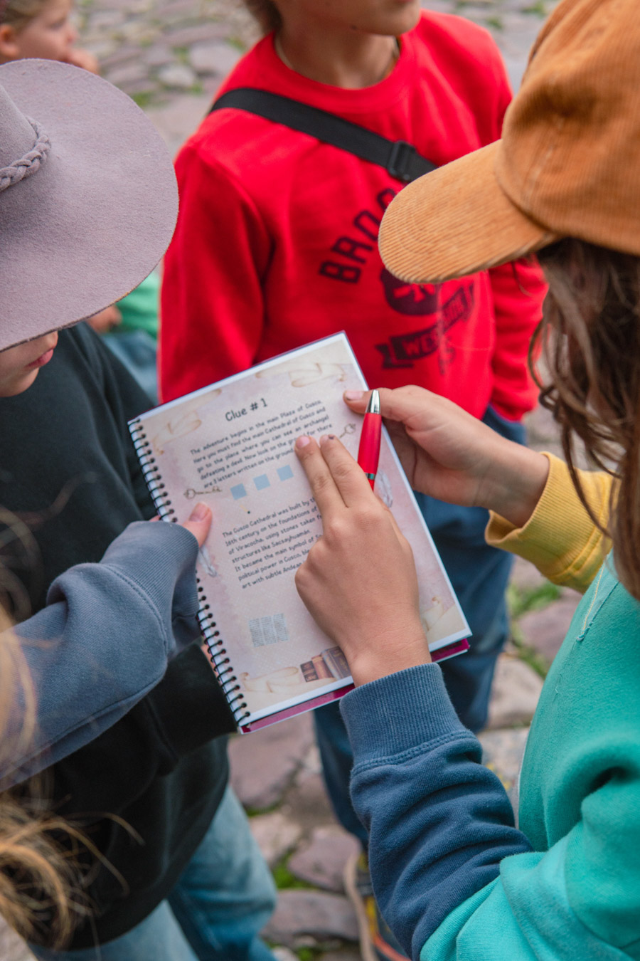 Children on a historical scavenger hunt in Cusco