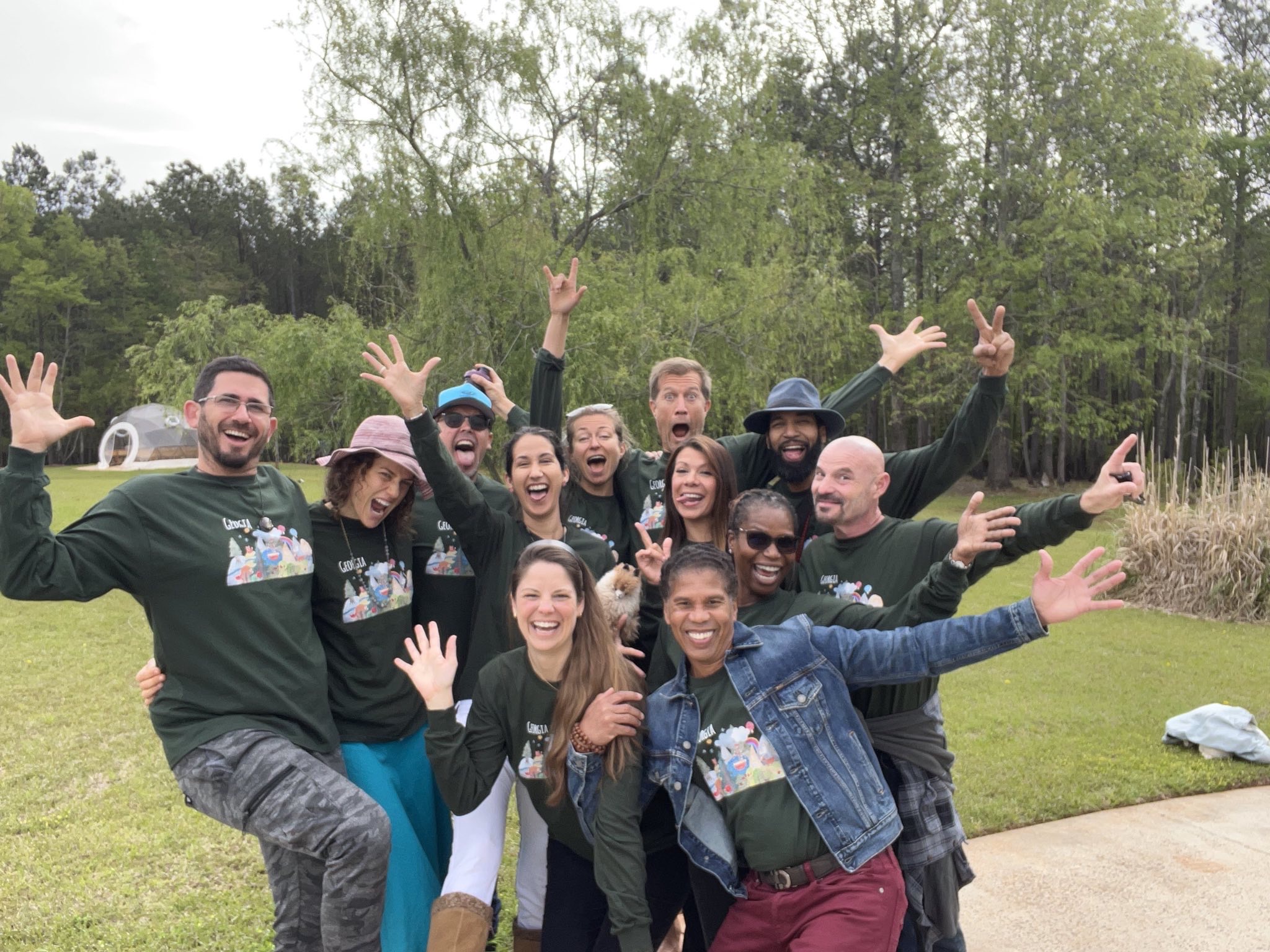 Purple Eagle Tribe community members gathered outdoors in celebration, connection, and shared transformation