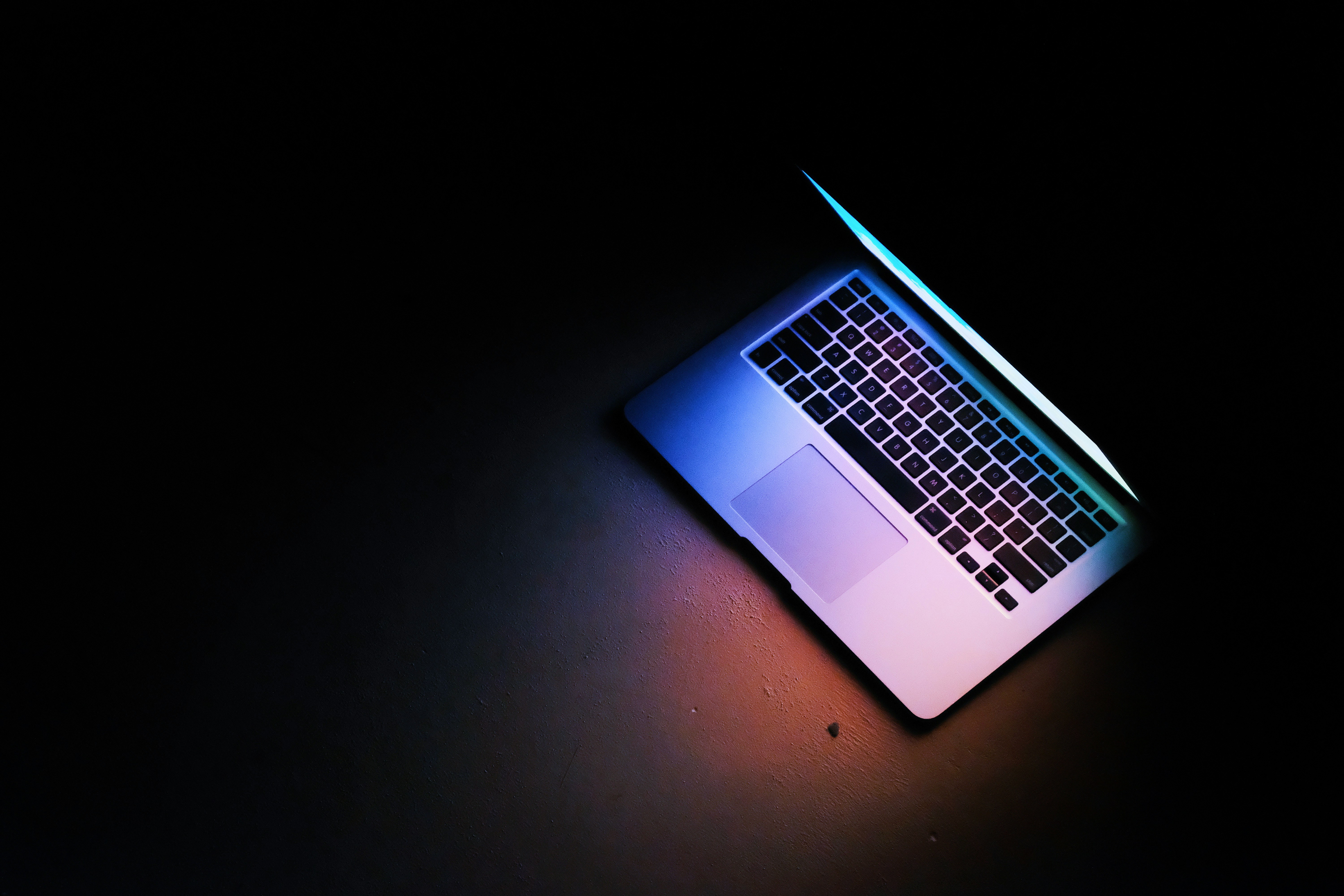 An image of a liteup laptop on a dark background