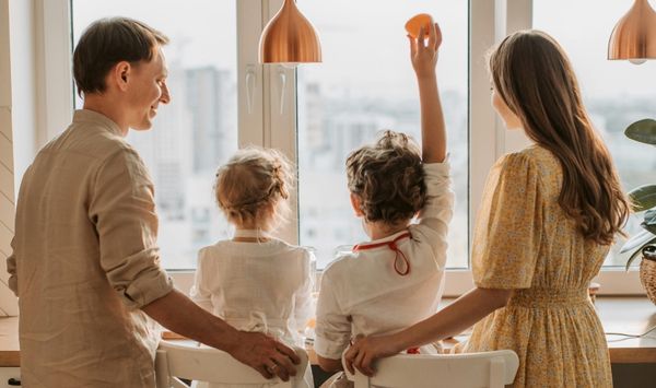 Family enjoying a bright, clean living space that reflects a comfortable pest-free tiny home environment