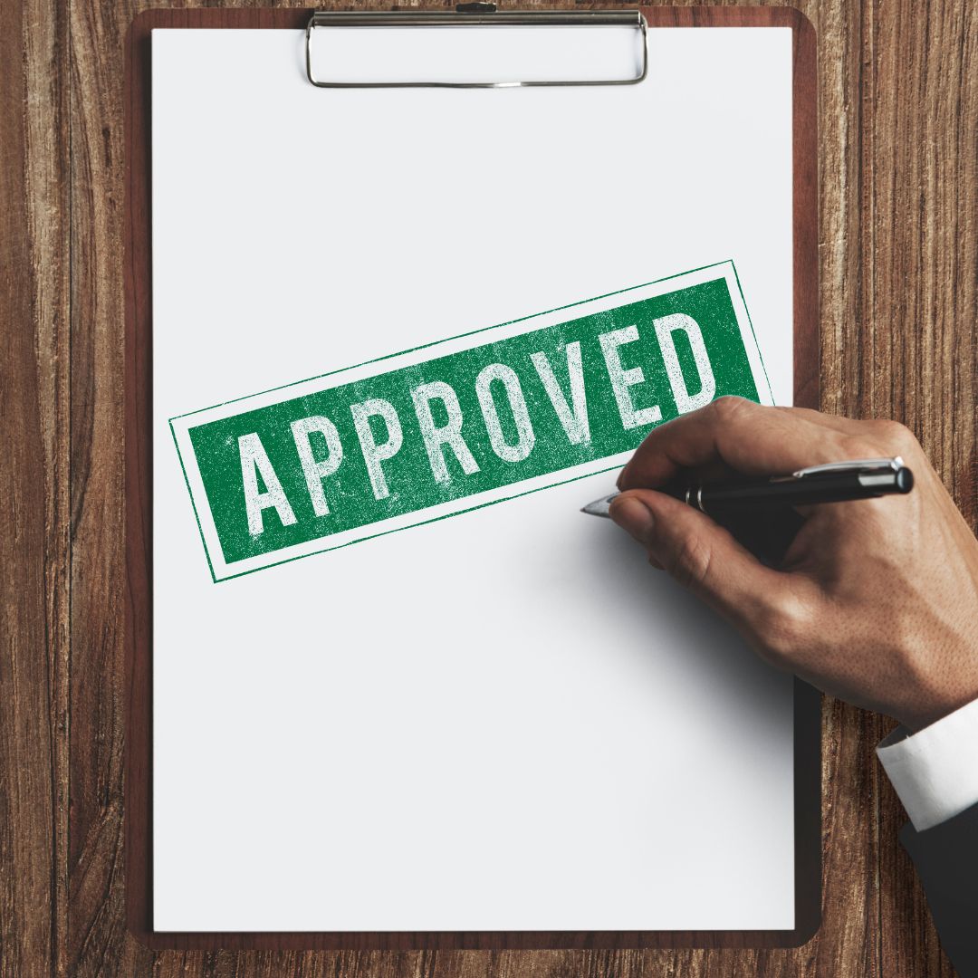 ADU permit document marked approved with a green stamp.