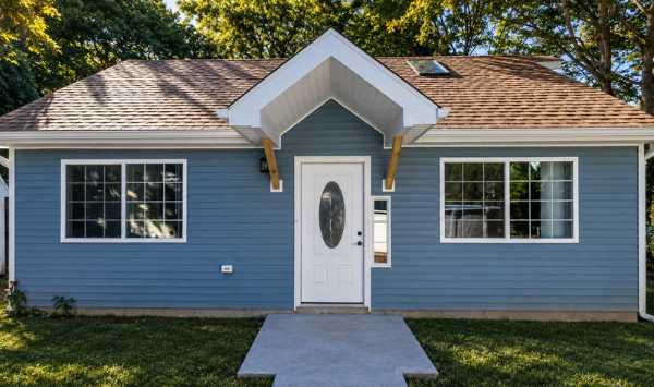 Blue detached ADU home in Connecticut with private entrance, large windows, and residential siding