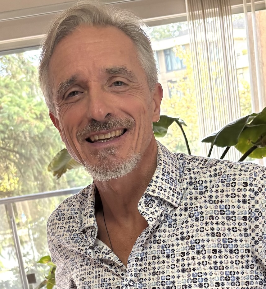 Portrait of the agency founder, a middle-aged entrepreneur with a confident smile, standing in front of a wall of client success stories and awards. The setting is bright and welcoming, conveying trust and leadership.