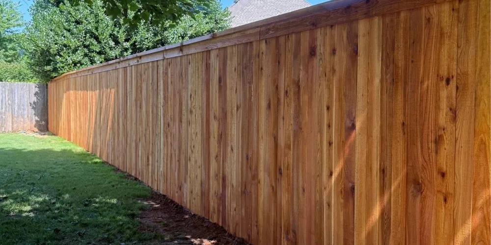 Wood privacy fence installation