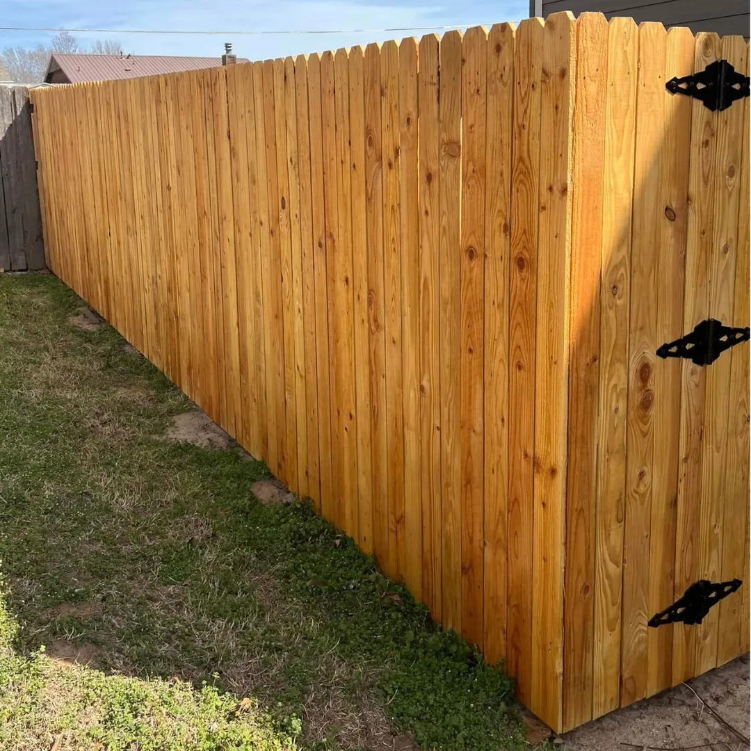 Wood privacy fence installation detail in Sapulpa, OK
