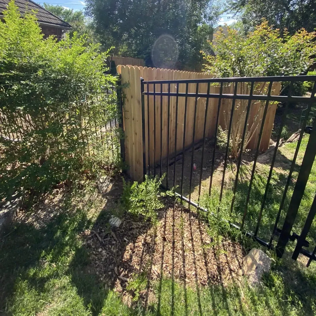 Wood privacy fence installation detail in Sapulpa, OK