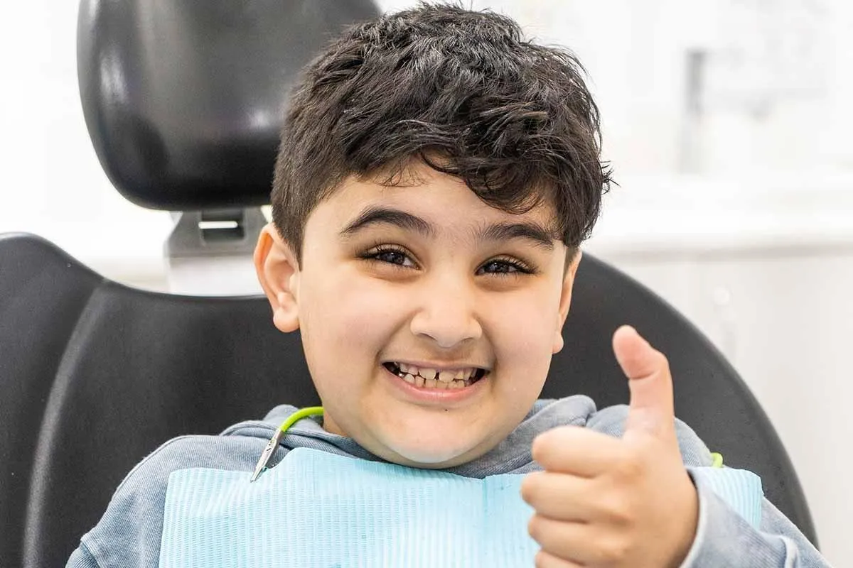 Smiling child with braces and parent at a friendly dental clinic in Blacktown