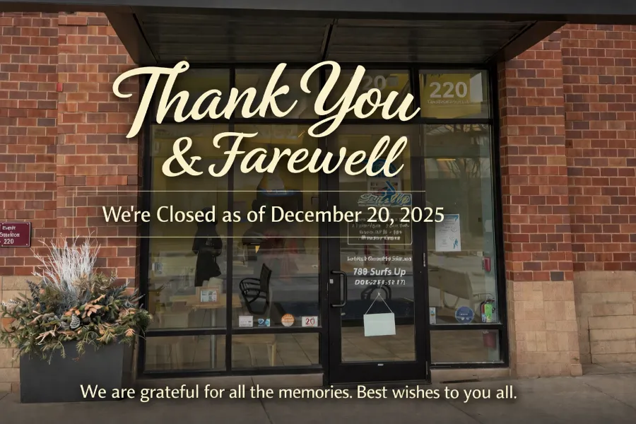 A diverse group of smiling customers and staff gathered inside a warmly lit local business, sharing laughter and conversation. The background features shelves with products and community photos. The scene radiates gratitude and togetherness, capturing a genuine moment of appreciation in a welcoming, familiar setting.