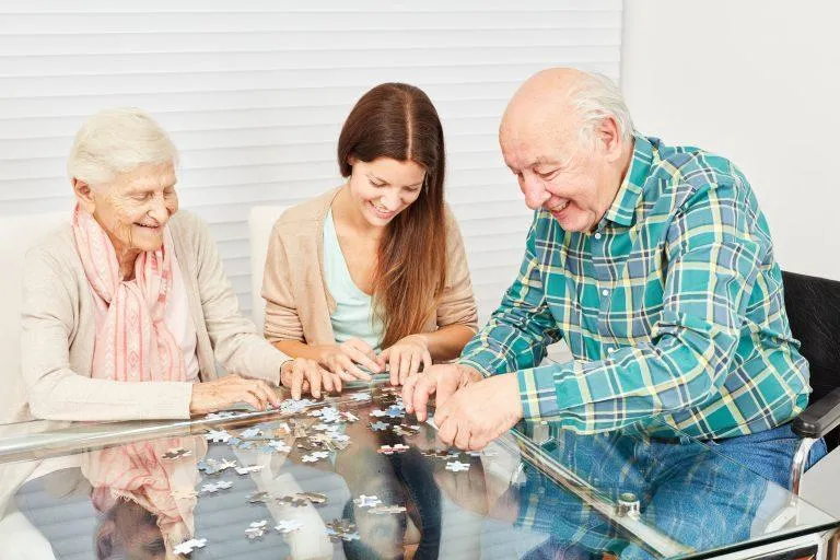 seniors improving brain fitness by playing puzzle games