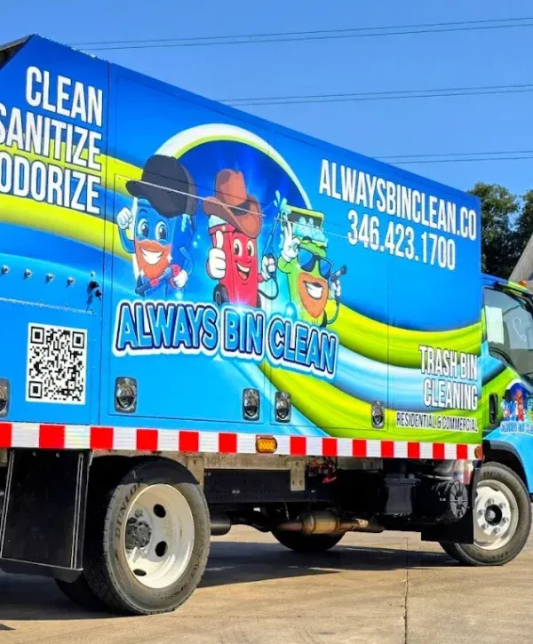 A brightly branded blue sanitation truck for Always Bin Clean, featuring cheerful trash bin characters and service details.