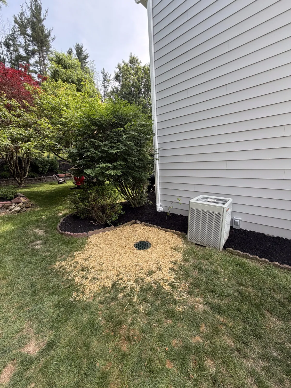 Yard drainage grate installed beside a home in Chester County PA