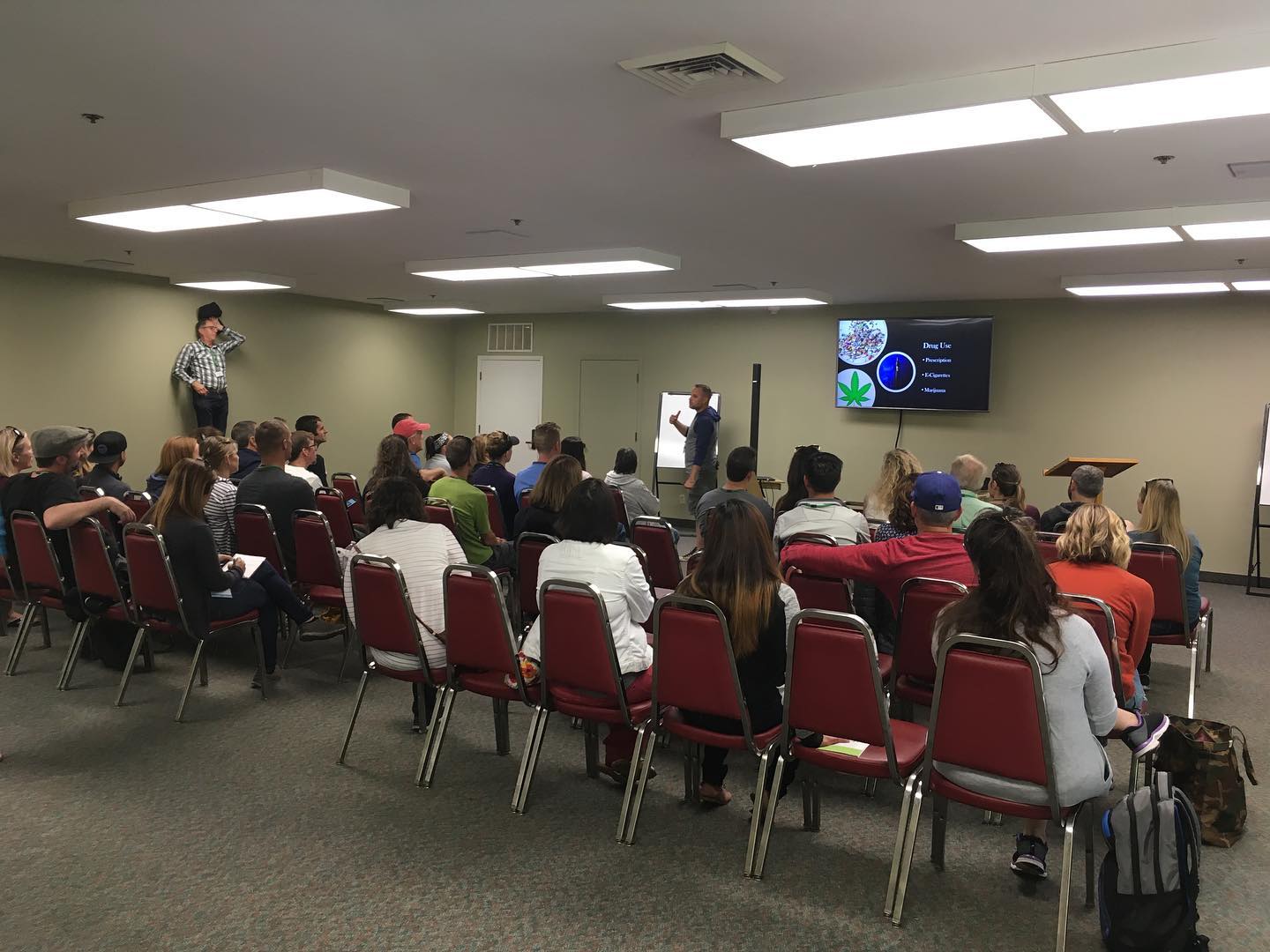 Man giving presentation in front of a group of people