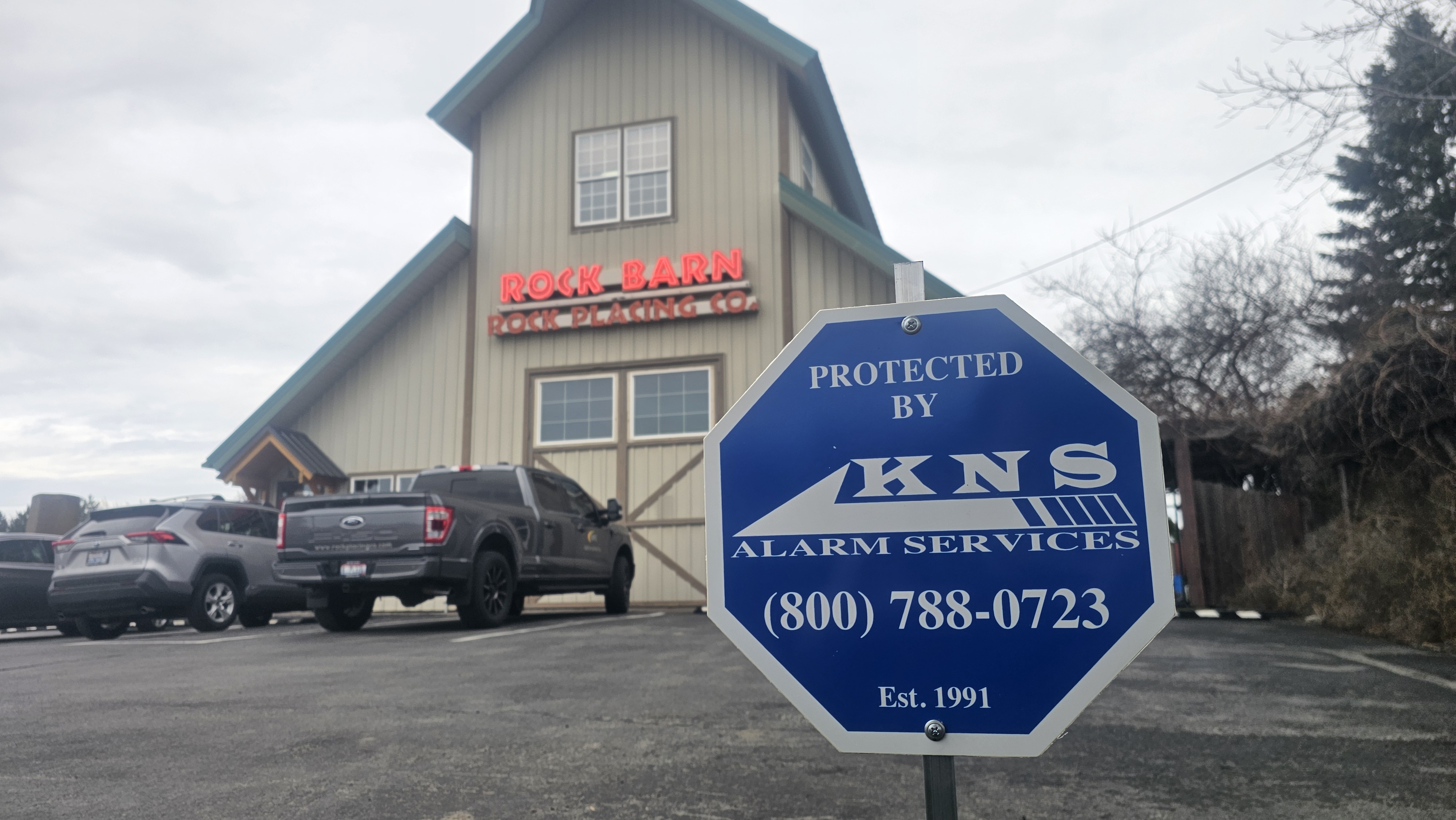 A lock on a wooden door with a chain on it